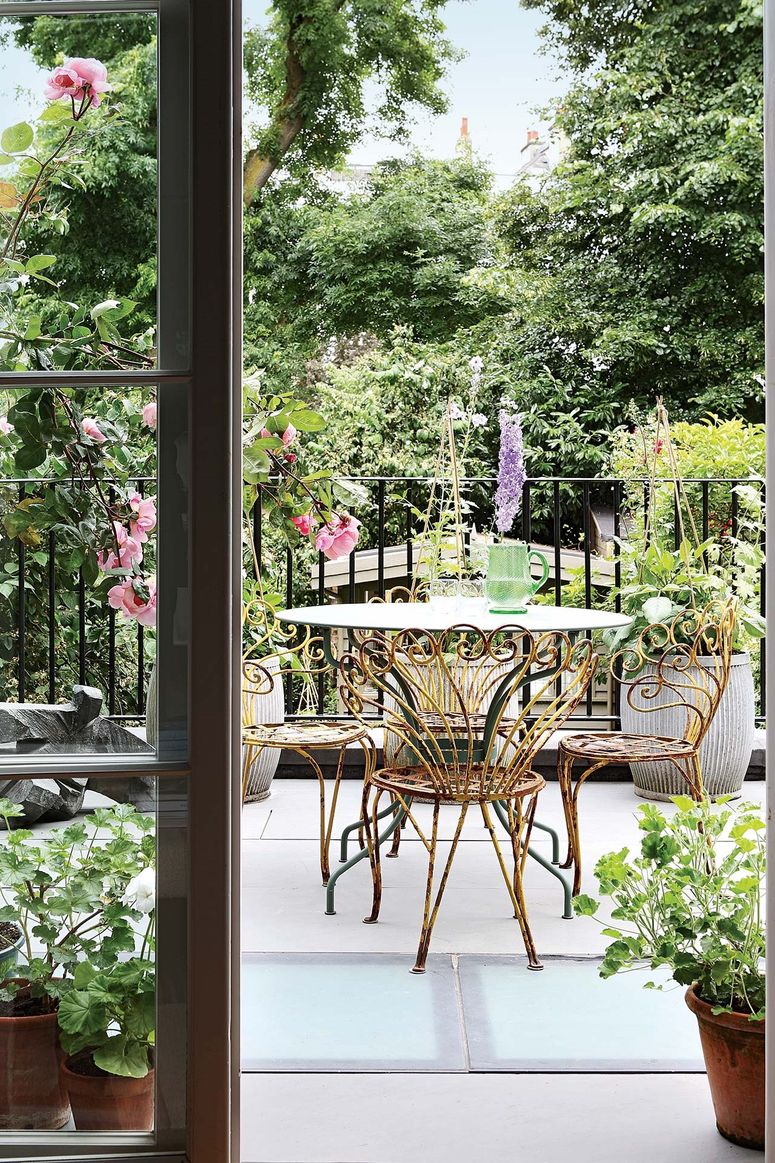 Image may contain: Furniture, Chair, Patio, and Porch