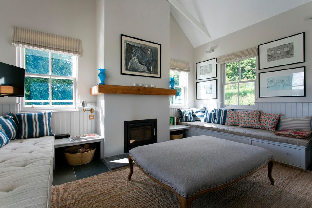 Image may contain Interior Design Indoors Home Decor Living Room Room Furniture Rug Hearth Fireplace and Bedroom