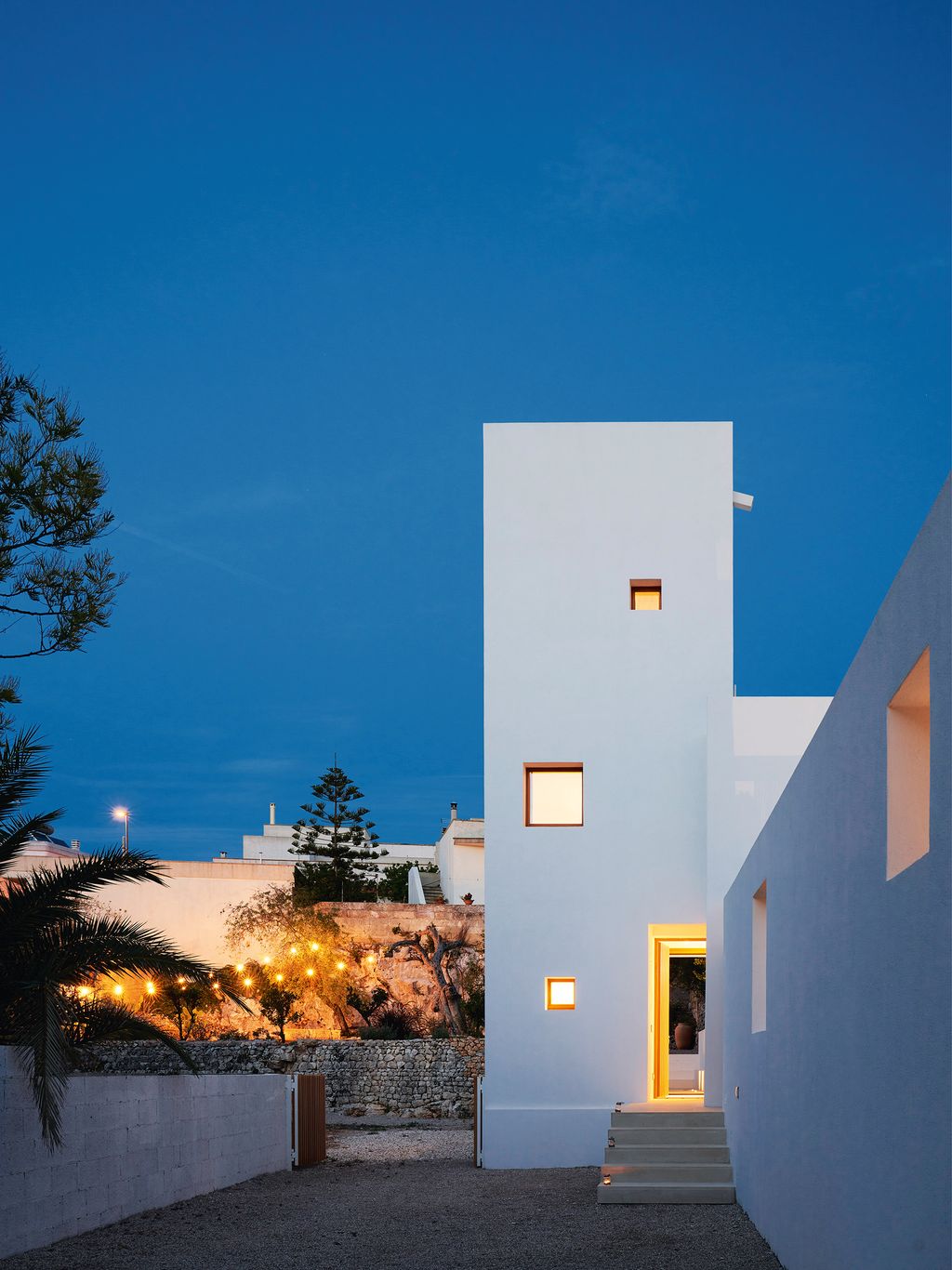 Image may contain Architecture Tower Building Tree Plant Spire Steeple Light Flare and Bell Tower