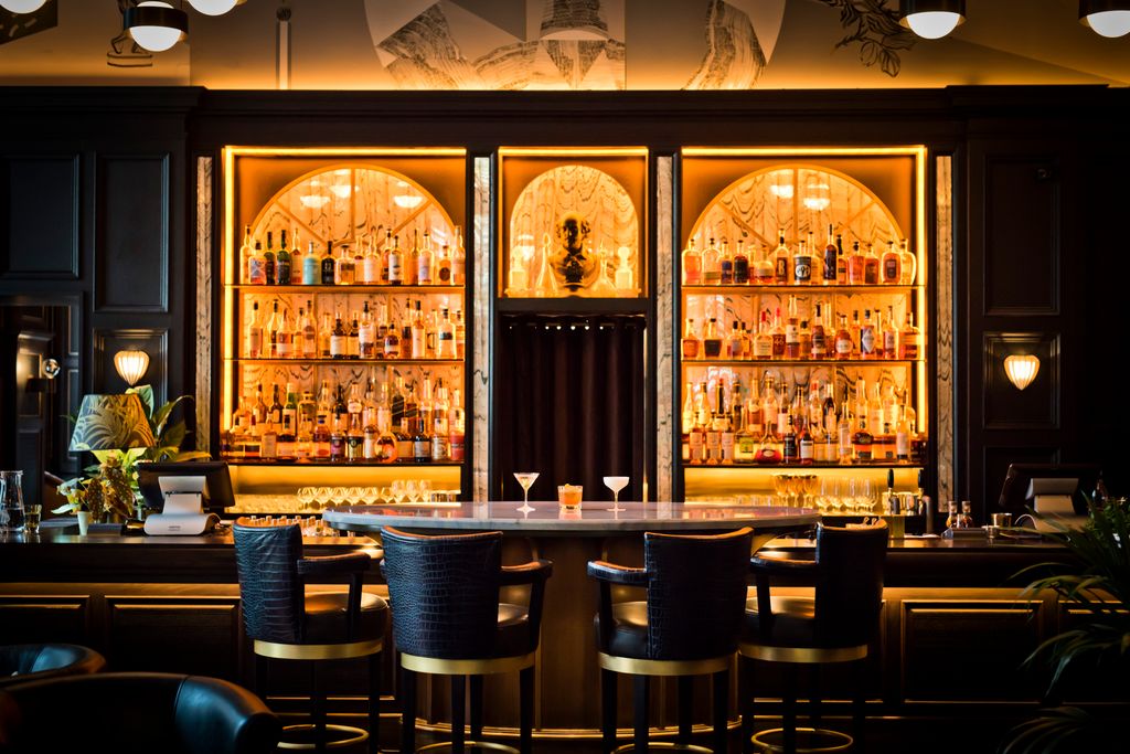 Image may contain Furniture Chair Pub Bar Counter Drink Wine Alcohol Beverage and Bottle