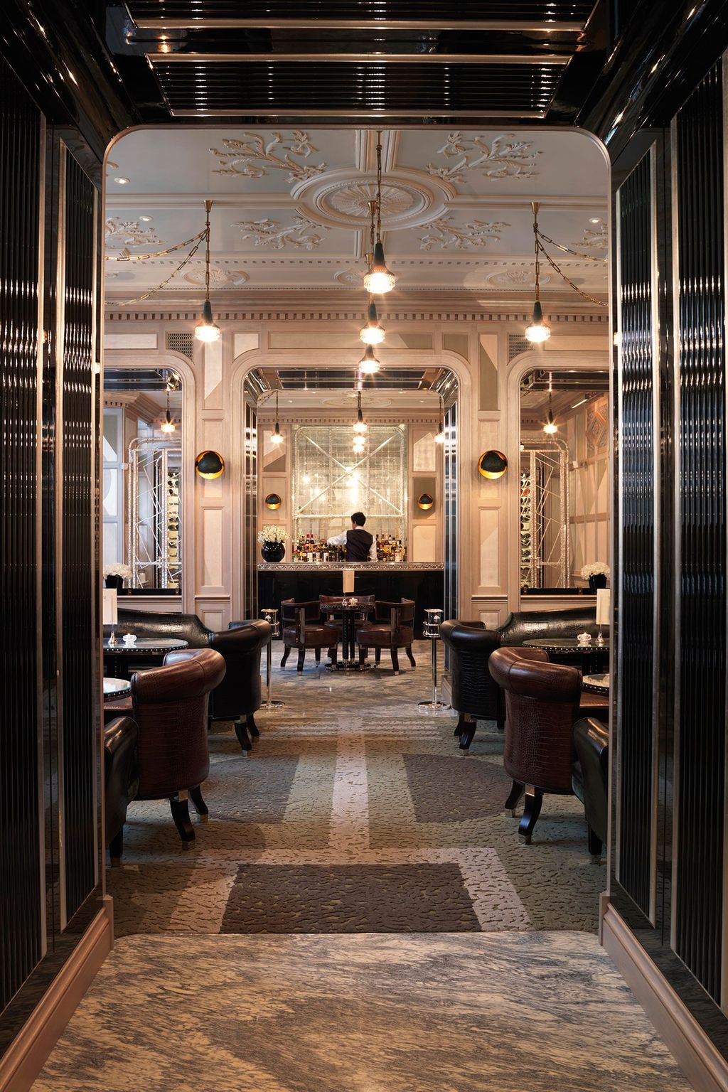 Image may contain Flooring Human Person Floor Furniture Chair Lobby Room Indoors Lighting Shop and Jewelry Store