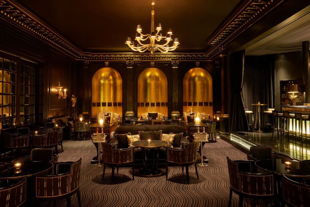 Image may contain Furniture Chair Indoors Lighting Room Restaurant Interior Design Lamp and Ballroom