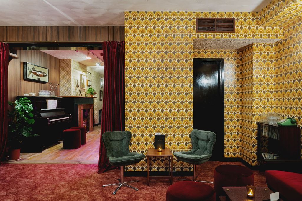 Image may contain Furniture Leisure Activities Living Room Room Indoors Musical Instrument Piano and Chair