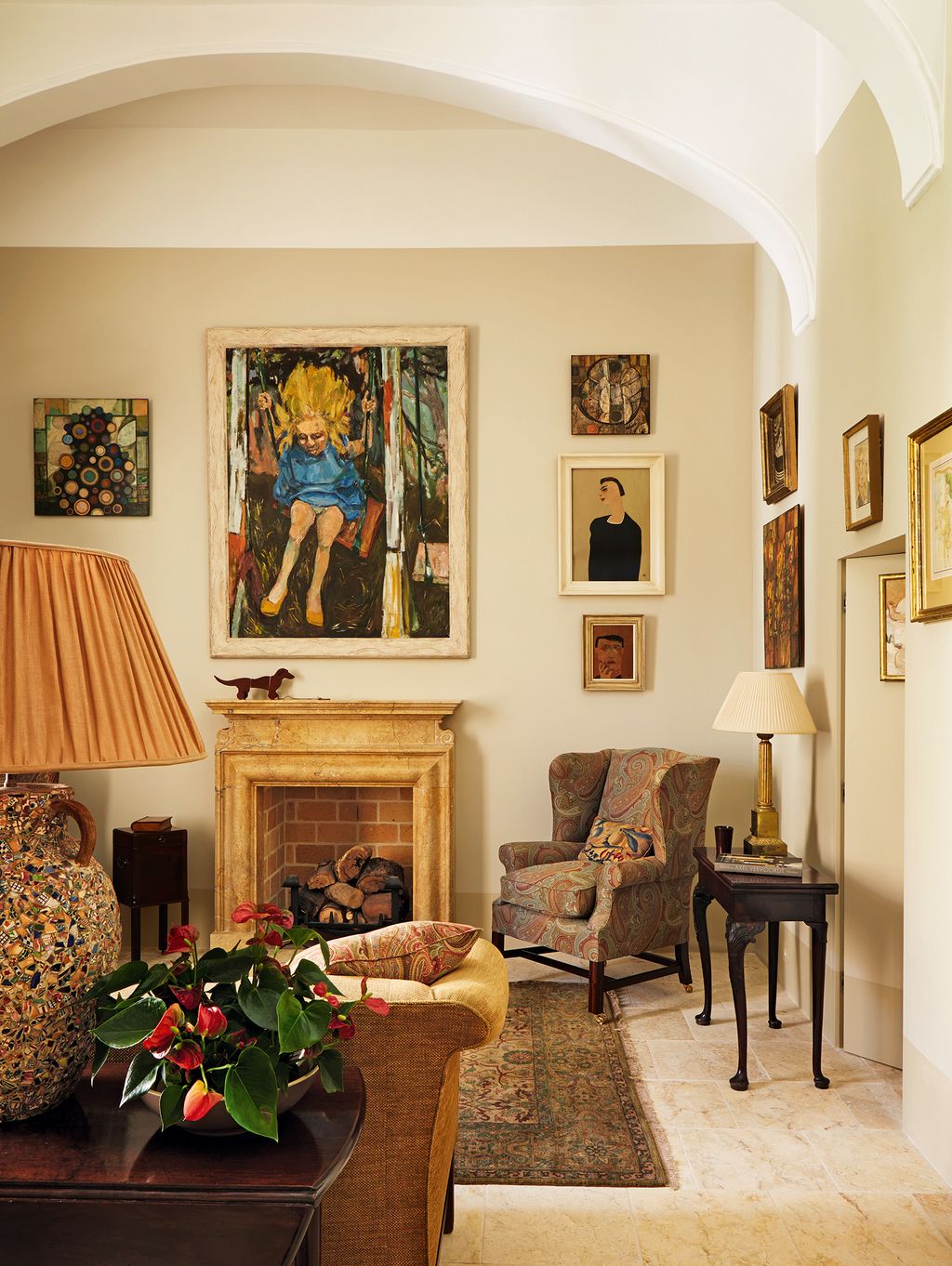 Image may contain Living Room Room Indoors Furniture Interior Design Flooring Human Person Chair and Lamp