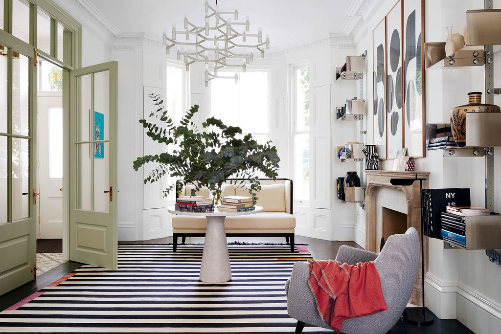 Image may contain Furniture Living Room Room Indoors Table Rug and Coffee Table