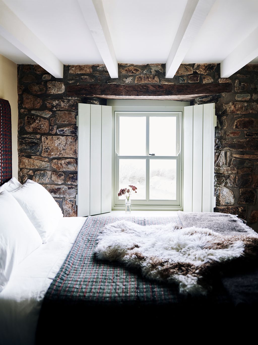 Image may contain Indoors Room Bedroom Interior Design Furniture and Living Room