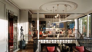 Image may contain Furniture Couch Living Room Room Indoors Flooring Human Person Interior Design Floor and Wood