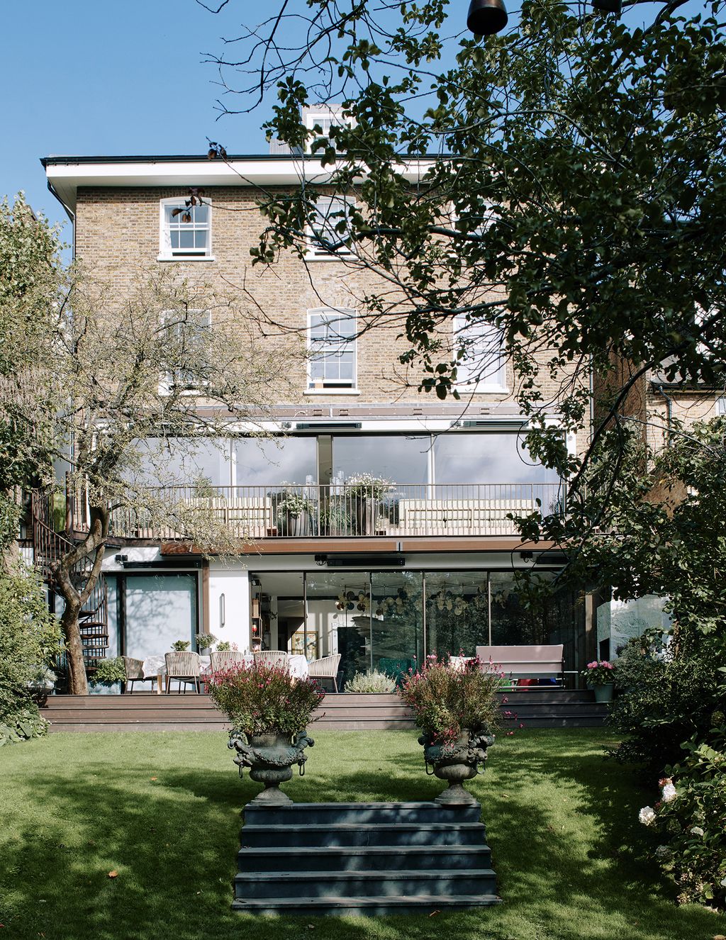 Image may contain Outdoors Patio Garden Plant Arbour Housing Building and Tree