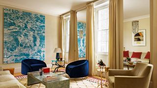 Image may contain Living Room Room Indoors Furniture Couch Flooring Table Coffee Table and Lobby