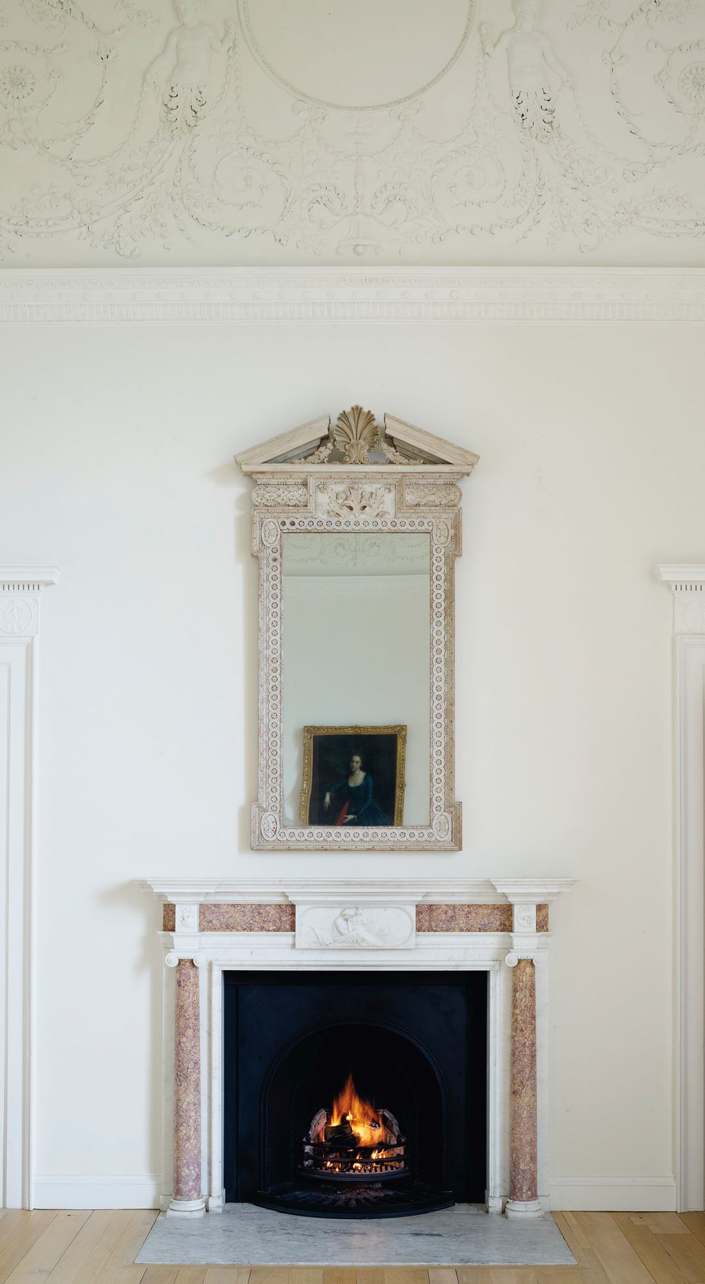 Image may contain Fireplace Indoors Hearth Living Room and Room