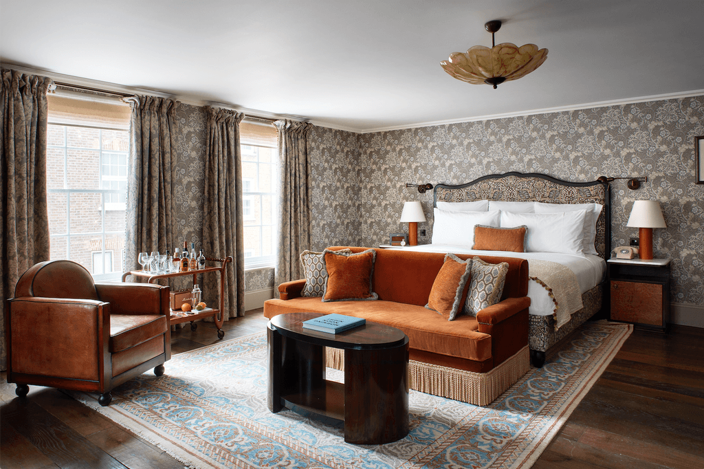 Image may contain Furniture Couch Living Room Room Indoors Flooring Rug and Wood