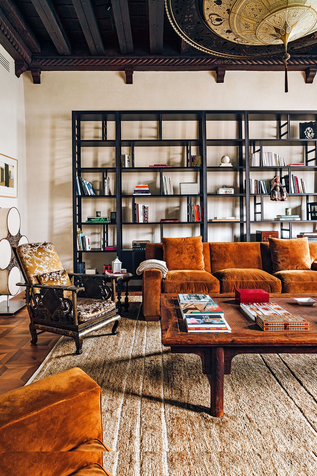 The deerskin armchairs and sofa and a large wooden bibliothèque were designed by Jacques.