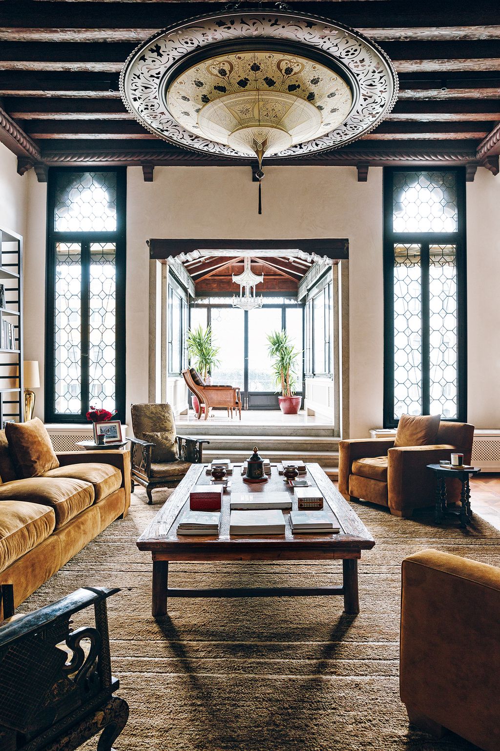 Image may contain Furniture Table Room Indoors Living Room Coffee Table Lobby Couch and Rug