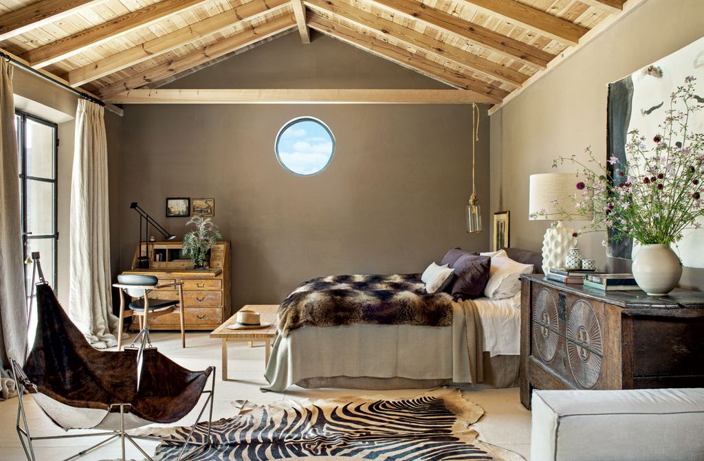 Image may contain Indoors Room Bedroom Furniture Housing Building Bed Rug and Living Room