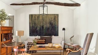 Image may contain Furniture Chair Living Room Room Indoors Table Coffee Table Interior Design Couch and Tabletop