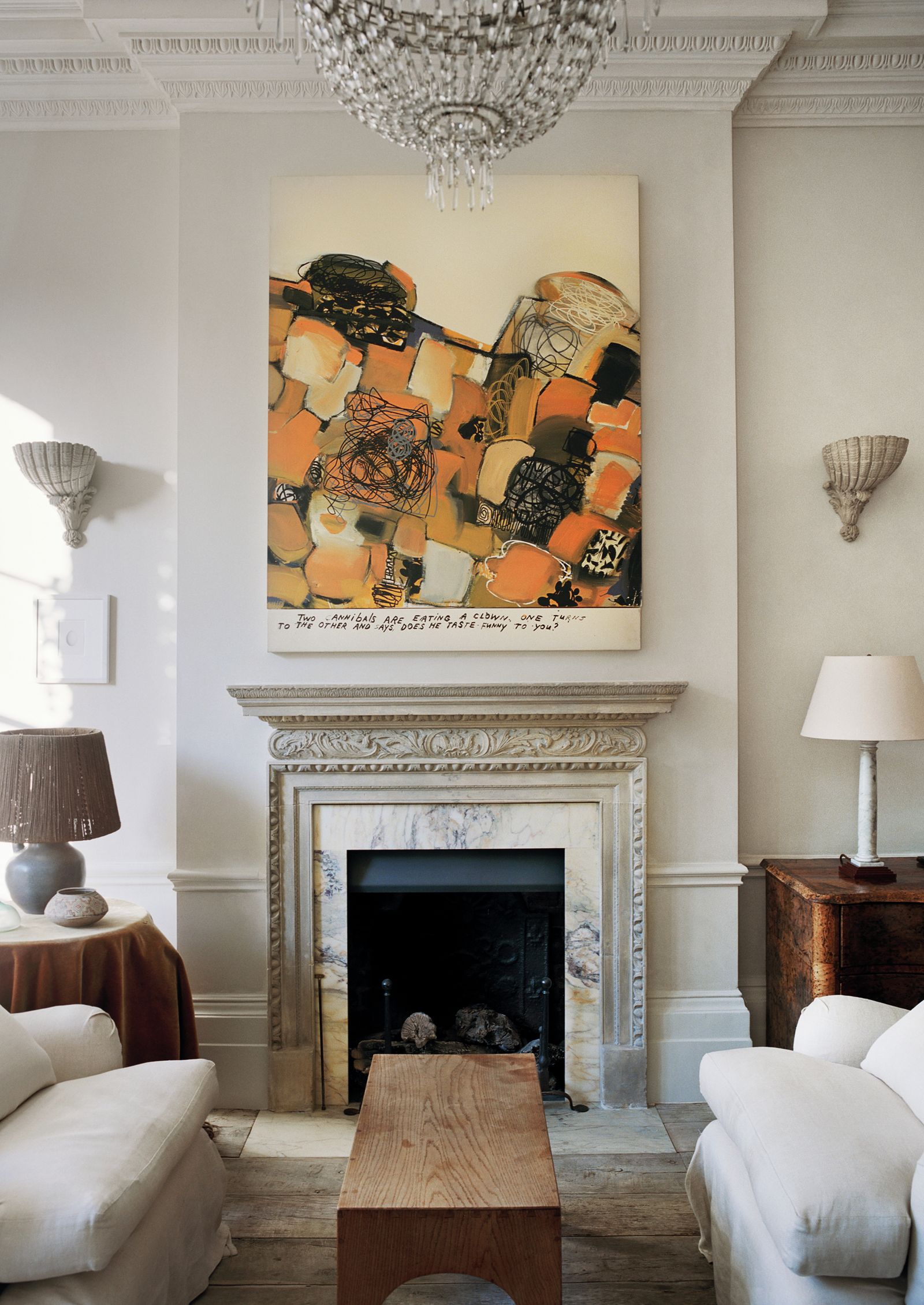 Image may contain Furniture Lamp Table Lamp Indoors Fireplace Hearth Living Room and Room