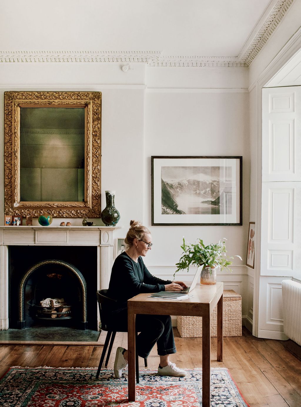 Emily Walsh managing director of The Fine Art Society at work in the bedroom of her house in Leith with pieces from her...
