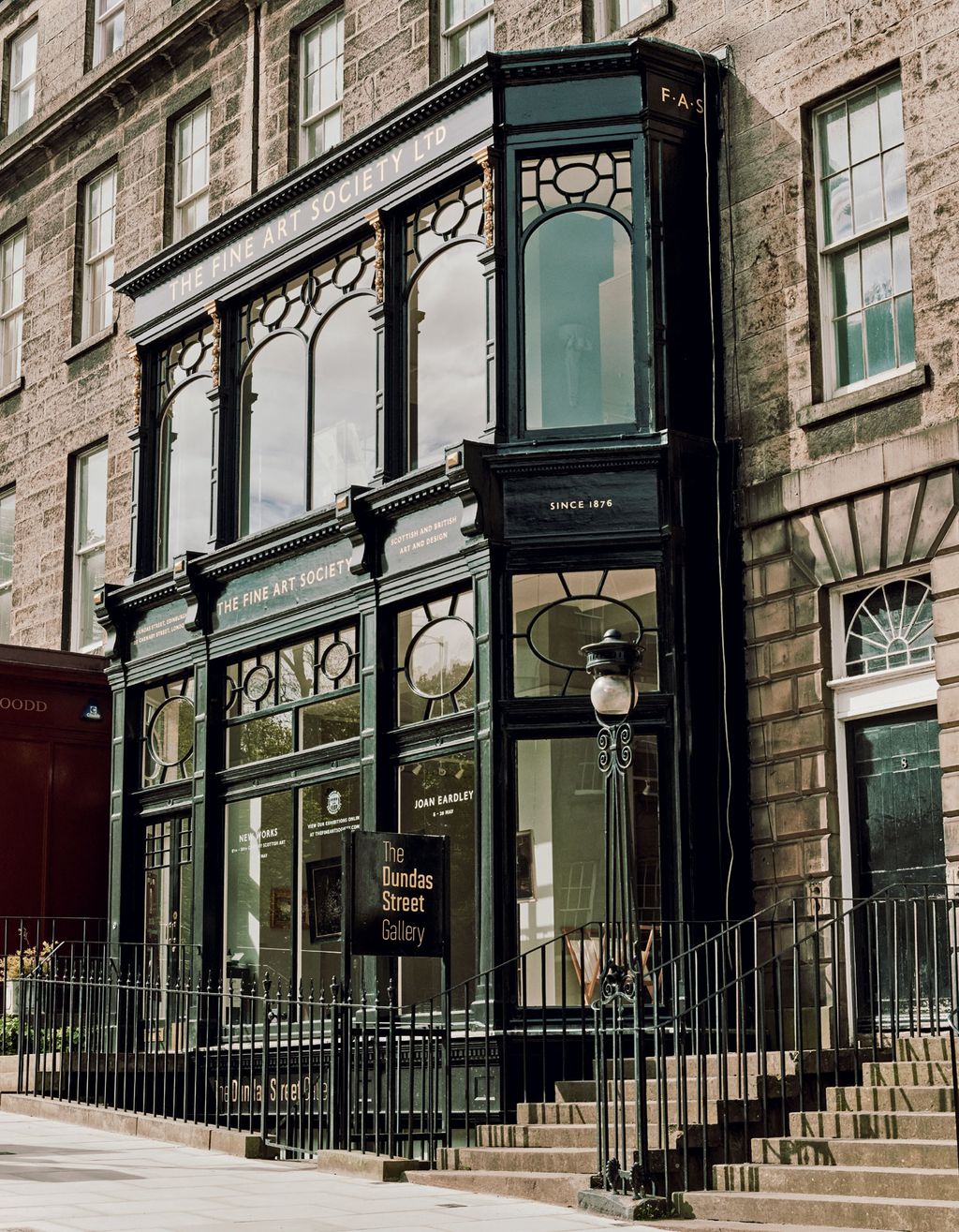 Image may contain Urban Building City Town Metropolis Architecture Banister Handrail Home Decor and Clock Tower