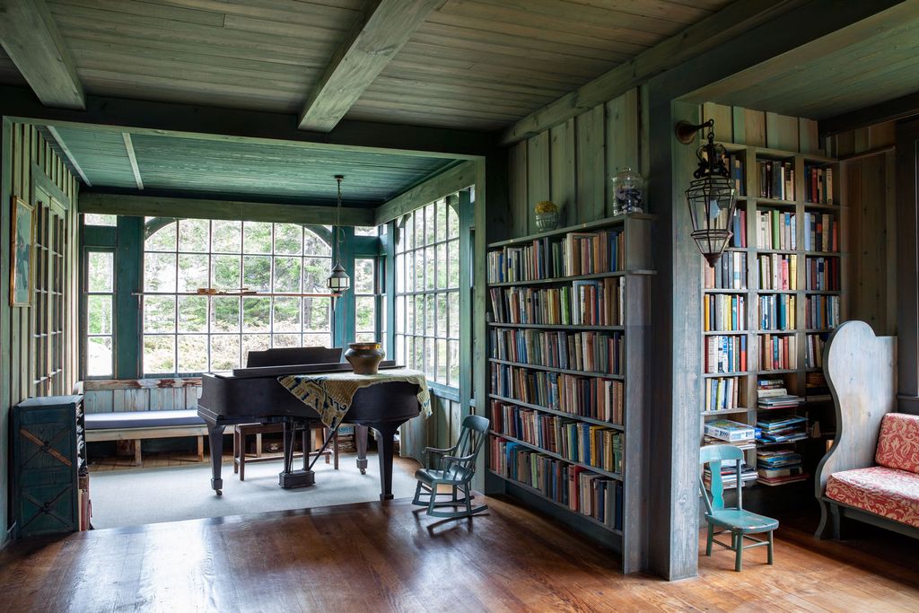 Image may contain Flooring Wood Furniture Hardwood Floor Chair Bookcase Shelf Indoors and Leisure Activities