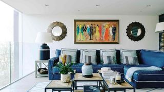 Image may contain Furniture Living Room Room Indoors Table Couch Coffee Table Interior Design and Cushion