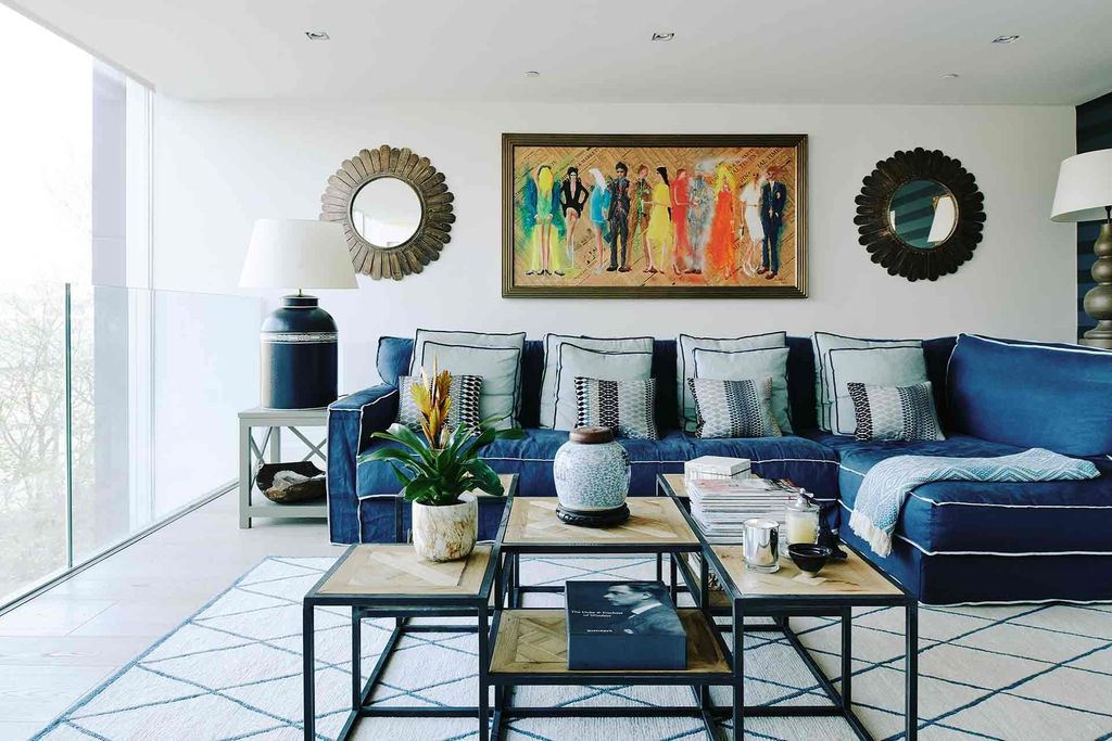 Image may contain Furniture Living Room Room Indoors Table Couch Coffee Table Interior Design and Cushion