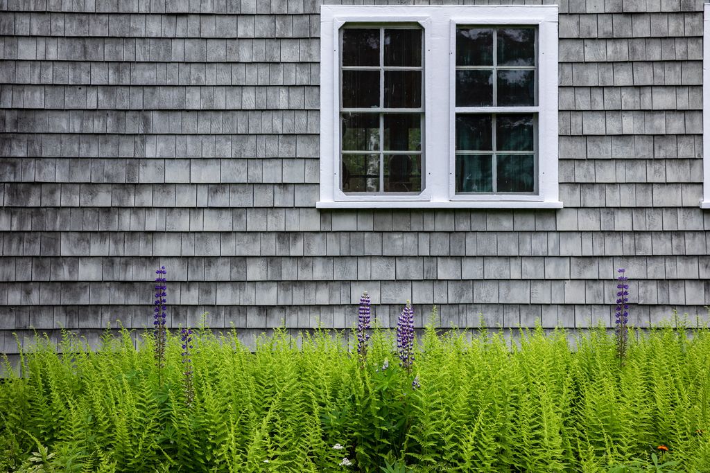 The whole Terry family got involved in hand dipping and applying the gray shingles that cover the entire house.