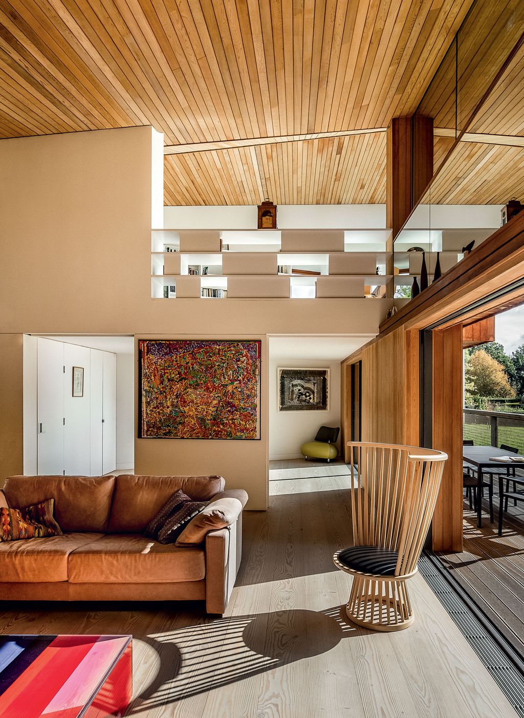 Image may contain Living Room Room Indoors Wood Furniture Interior Design Couch and Rug