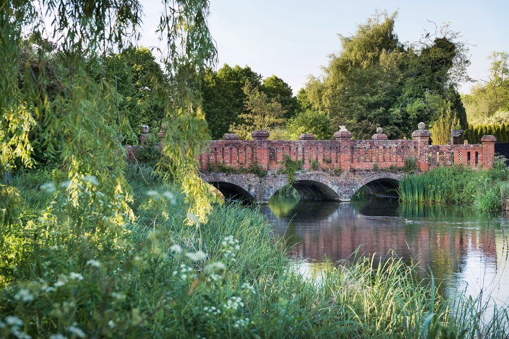 Image may contain Outdoors Water Architecture Building Castle Bridge Nature Fort Human Person Ditch and Path