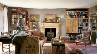 Image may contain Living Room Room Indoors Furniture Couch Interior Design Home Decor and Shelf