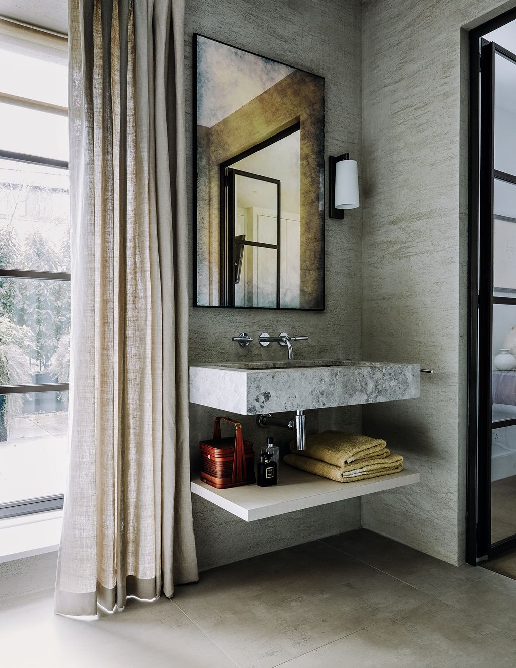 Taps by CEA Design complement a basin from Marble City.