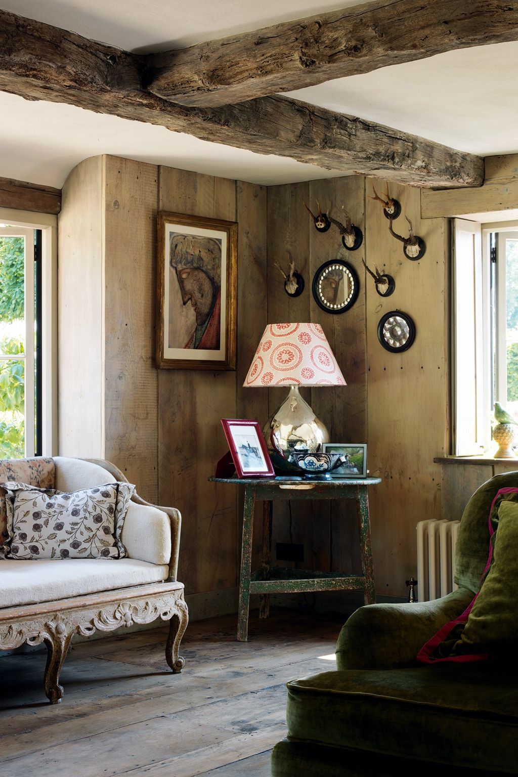 Image may contain Living Room Room Indoors Furniture Couch Interior Design Lamp Table Lamp and Cushion