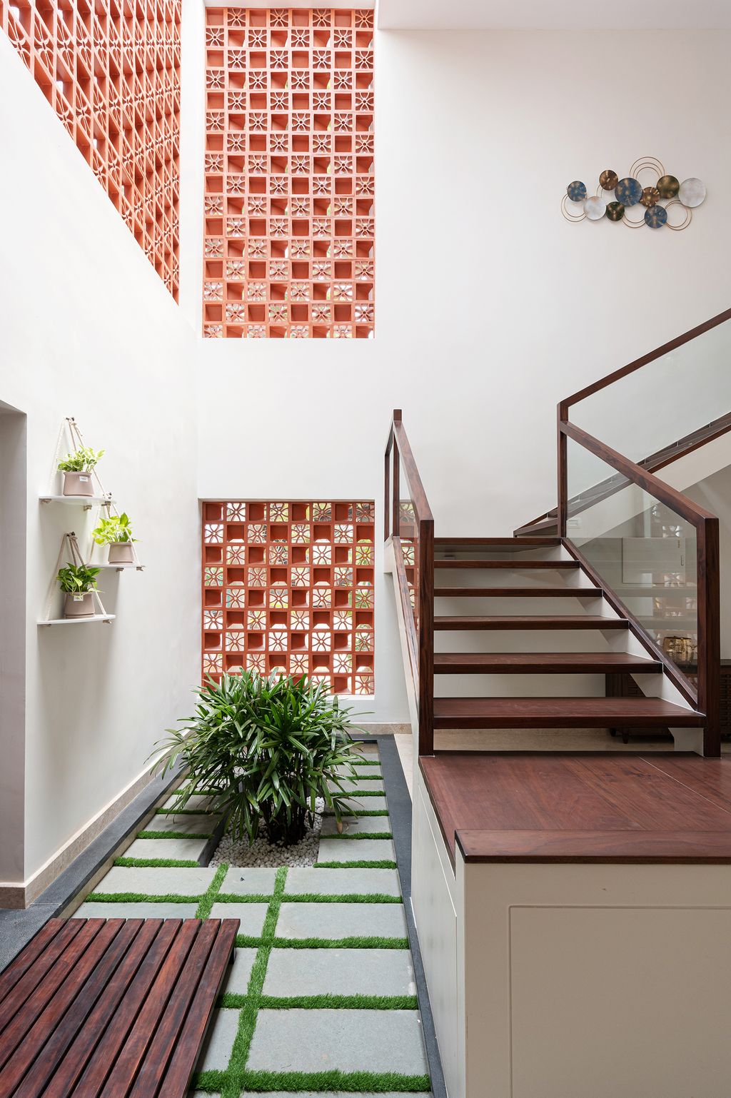 Lots of lateral space allows for stairs to take up more space in a room. Here Simone de Gale added a wraparound...