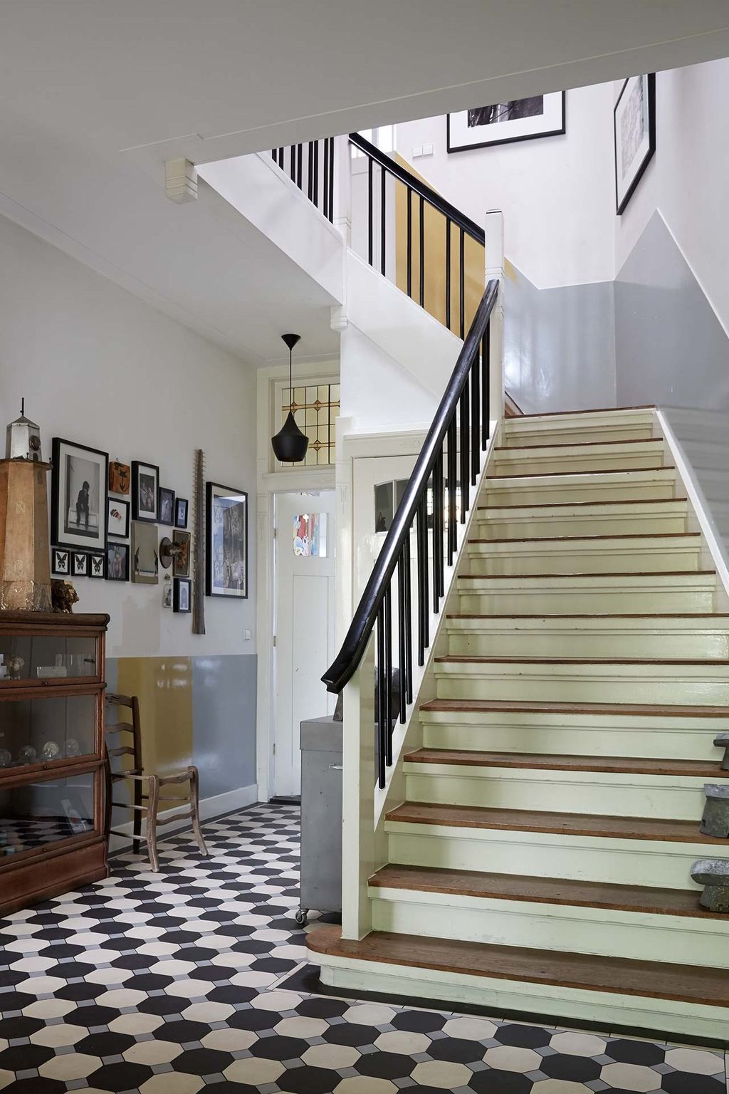 Image may contain Staircase Wood Banister Handrail Interior Design Indoors Flooring Hardwood Living Room and Room