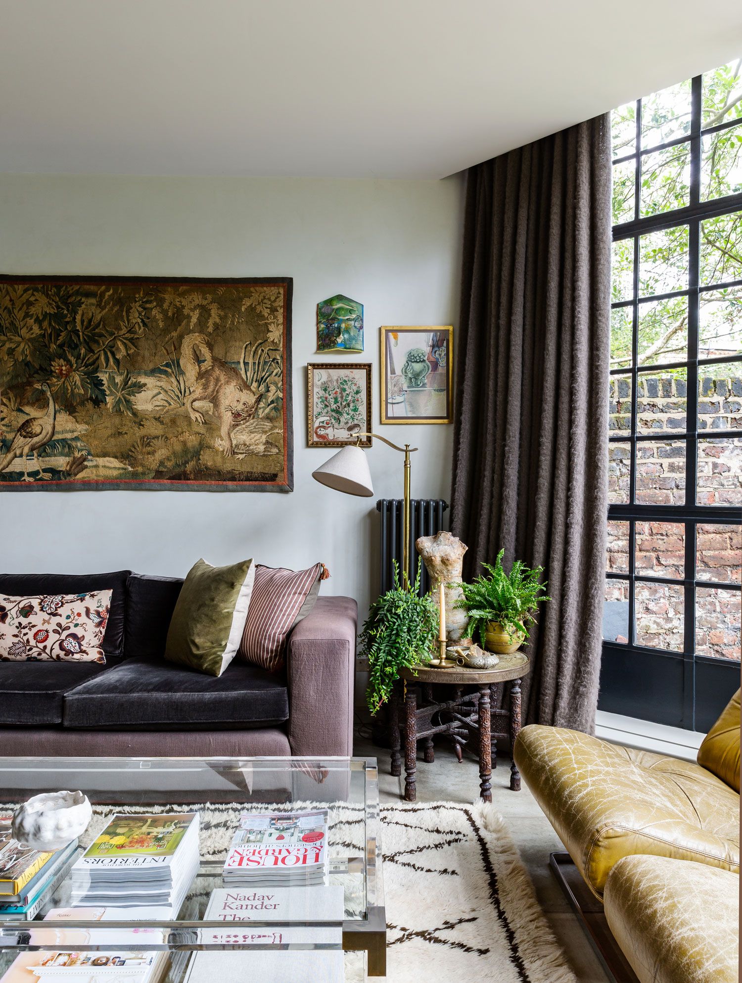 Image may contain Couch Furniture Living Room Indoors Room Cushion Table Rug and Coffee Table