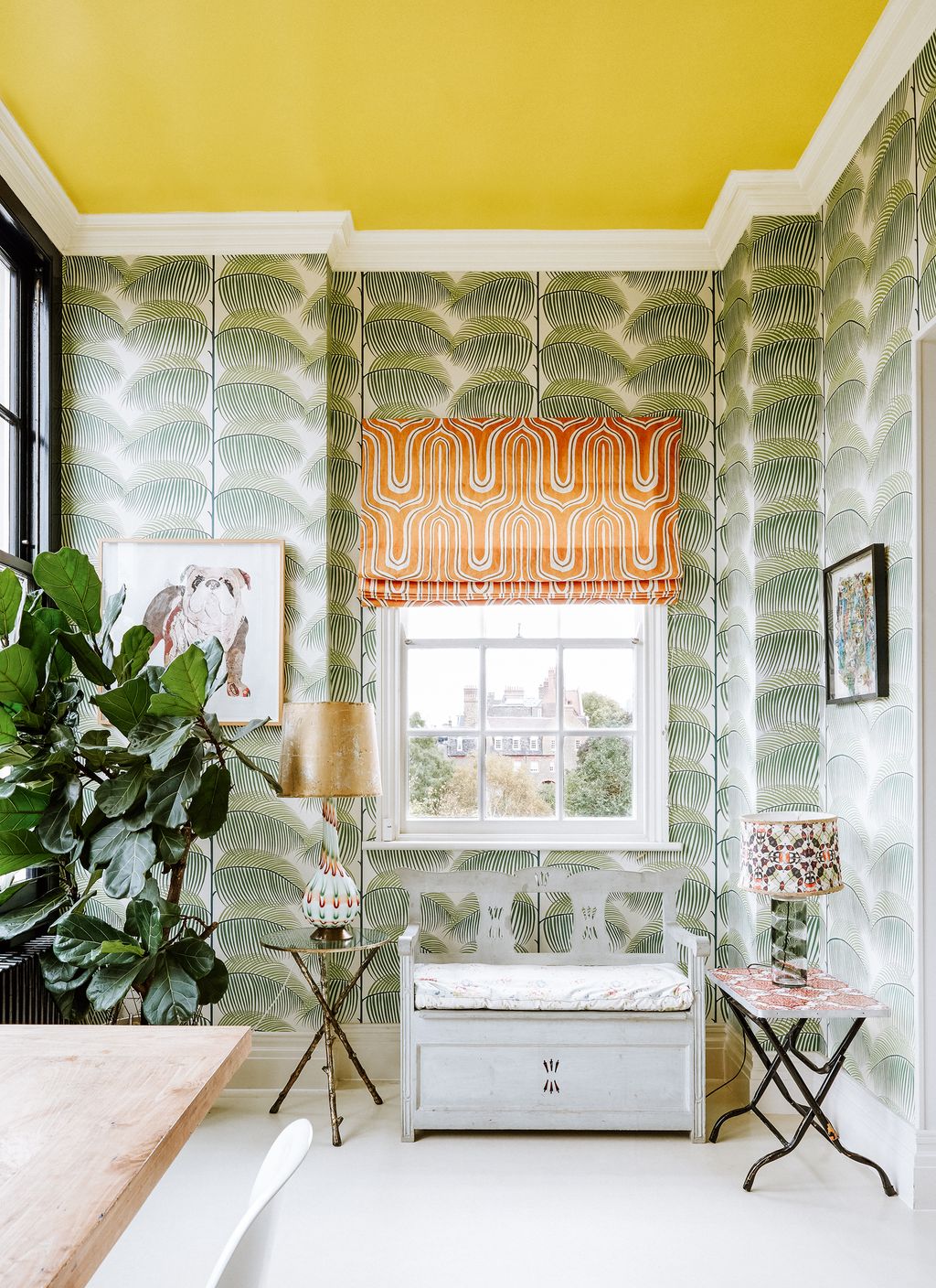 Colourful lamps made from converted vases stand on small tables throughout the openplan space.