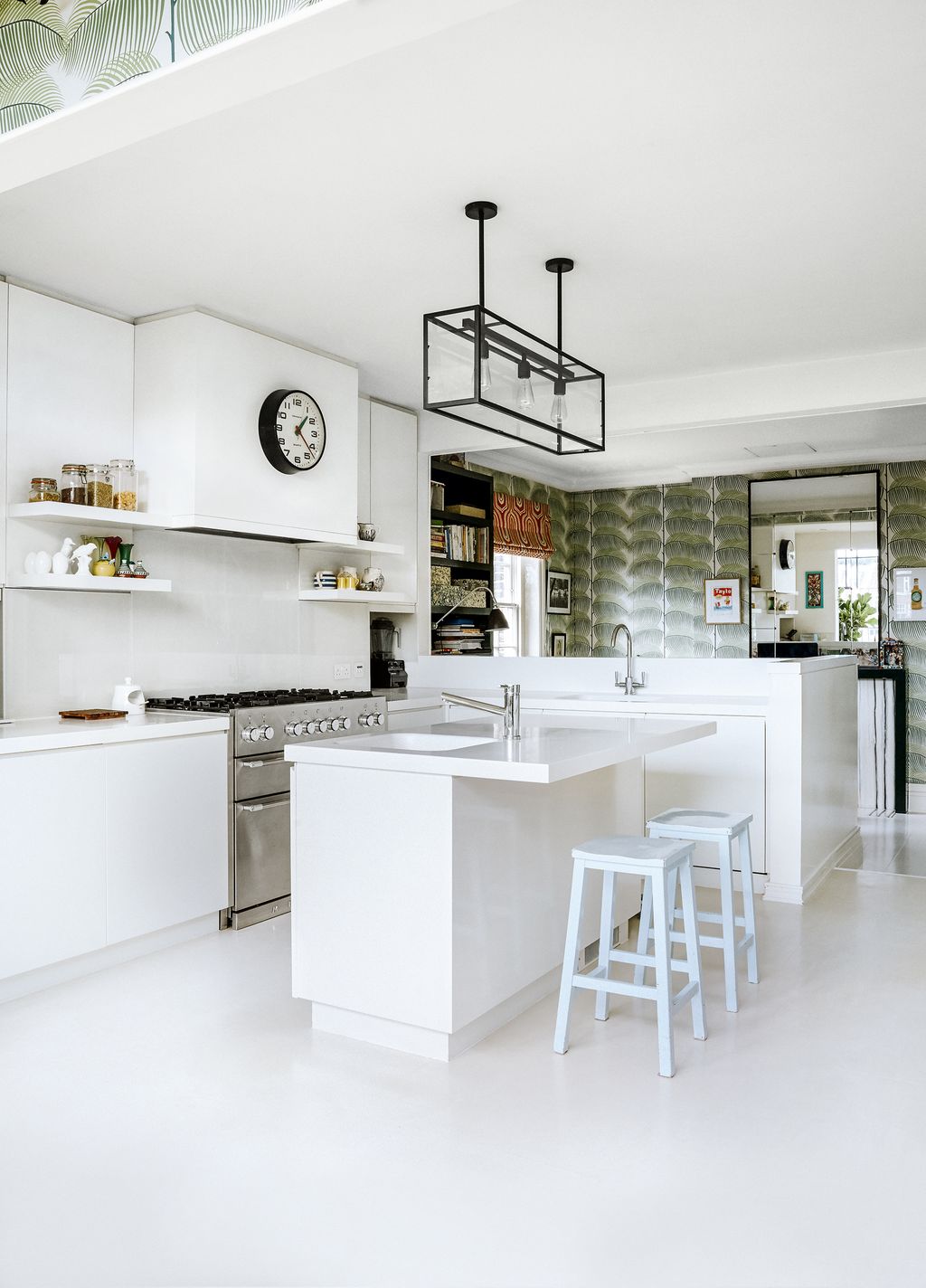 Image may contain Indoors Furniture Room Building Clock Tower Architecture Tower Kitchen Island Kitchen and Housing