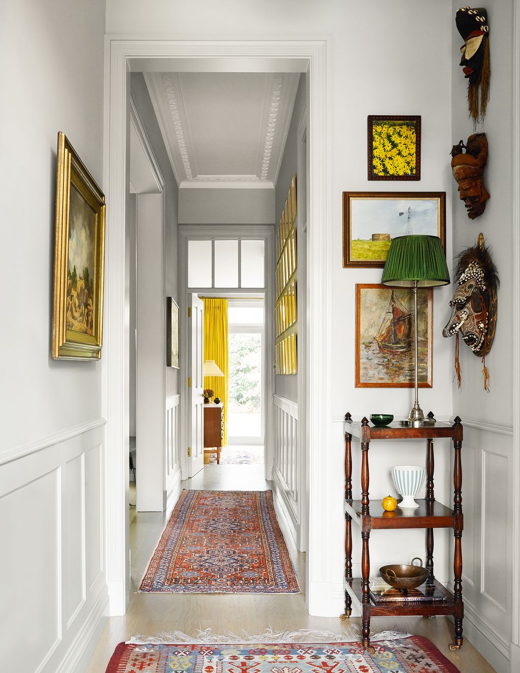 Tribal masks from the Congo and Papua New Guinea and paintings by amateur artists add decorative detail to the hall.