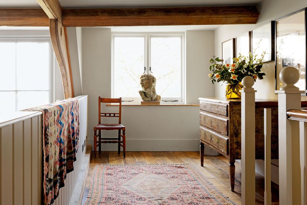 Image may contain Plant Interior Design Indoors Rug Furniture Chair and Flooring