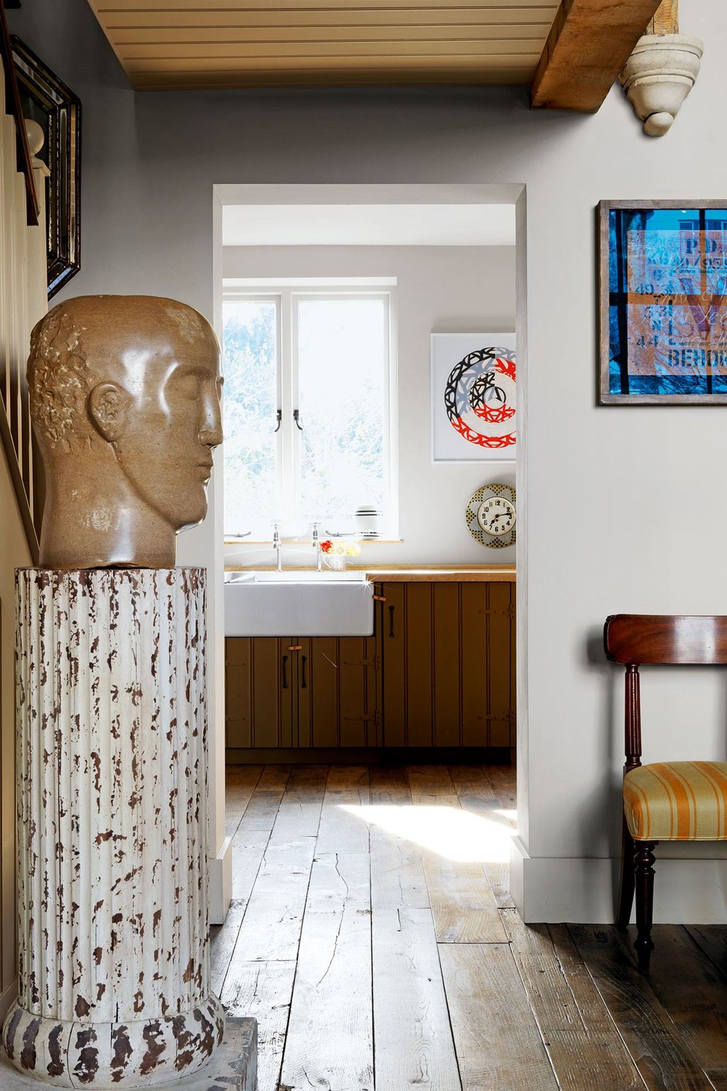 Image may contain Flooring Floor Wood Interior Design Indoors Hardwood Furniture Living Room Room Chair and Art