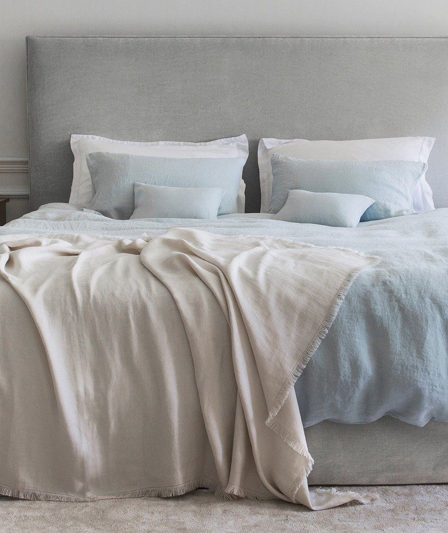 Image may contain Blanket Furniture and Bed