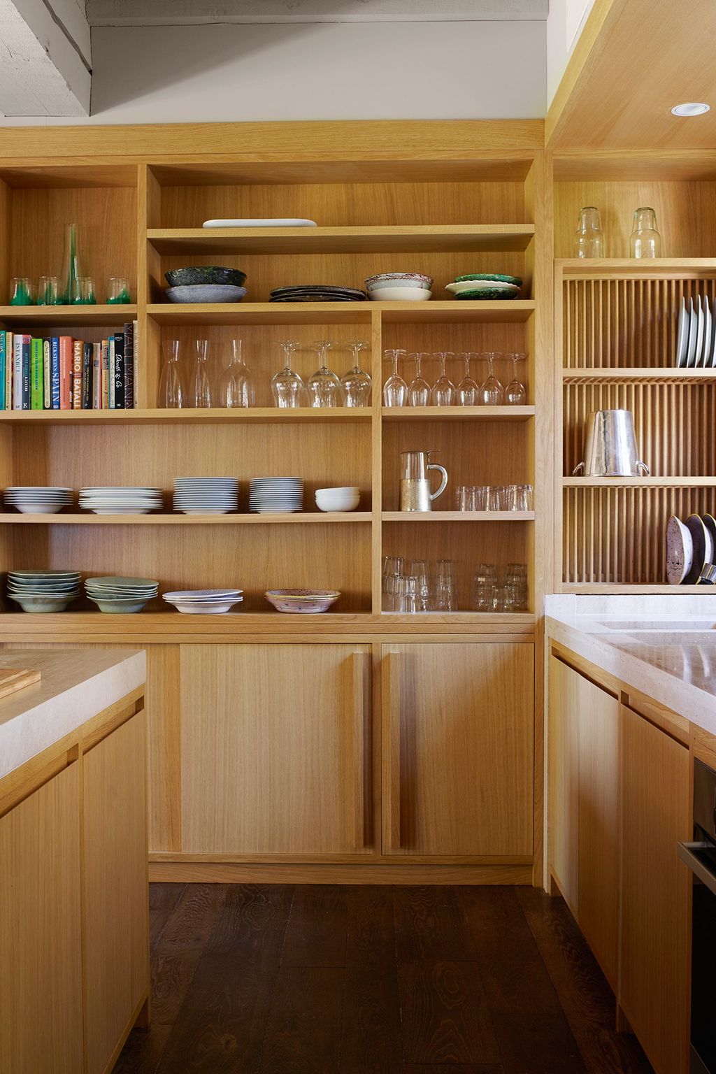 Indented shelf interiors are a clever way to organize plates.