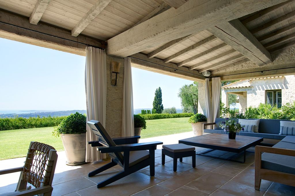 Image may contain Furniture Chair Table Flooring Floor Coffee Table Patio Couch Porch and Plant