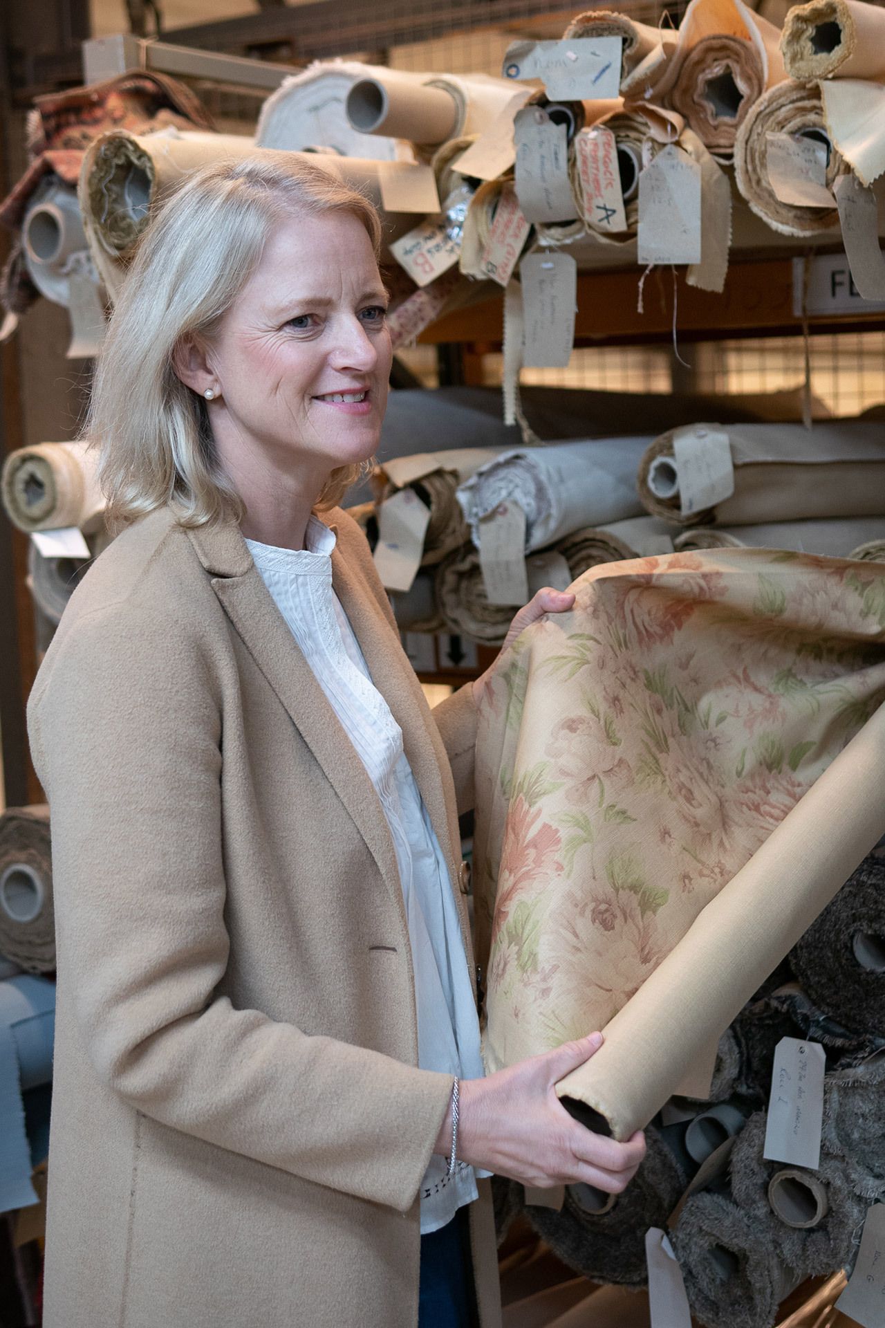 Image may contain Clothing Apparel Human Person Sleeve Home Decor Fashion Robe Suit Coat Overcoat and Wood