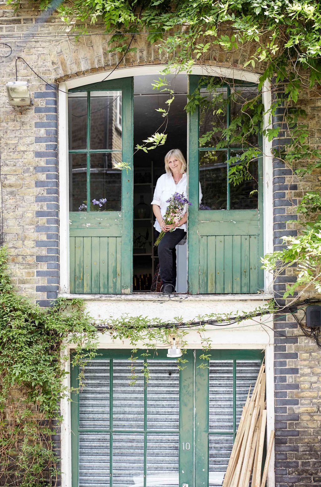 Image may contain Home Decor Human Person Window Clothing Apparel Footwear and Shoe