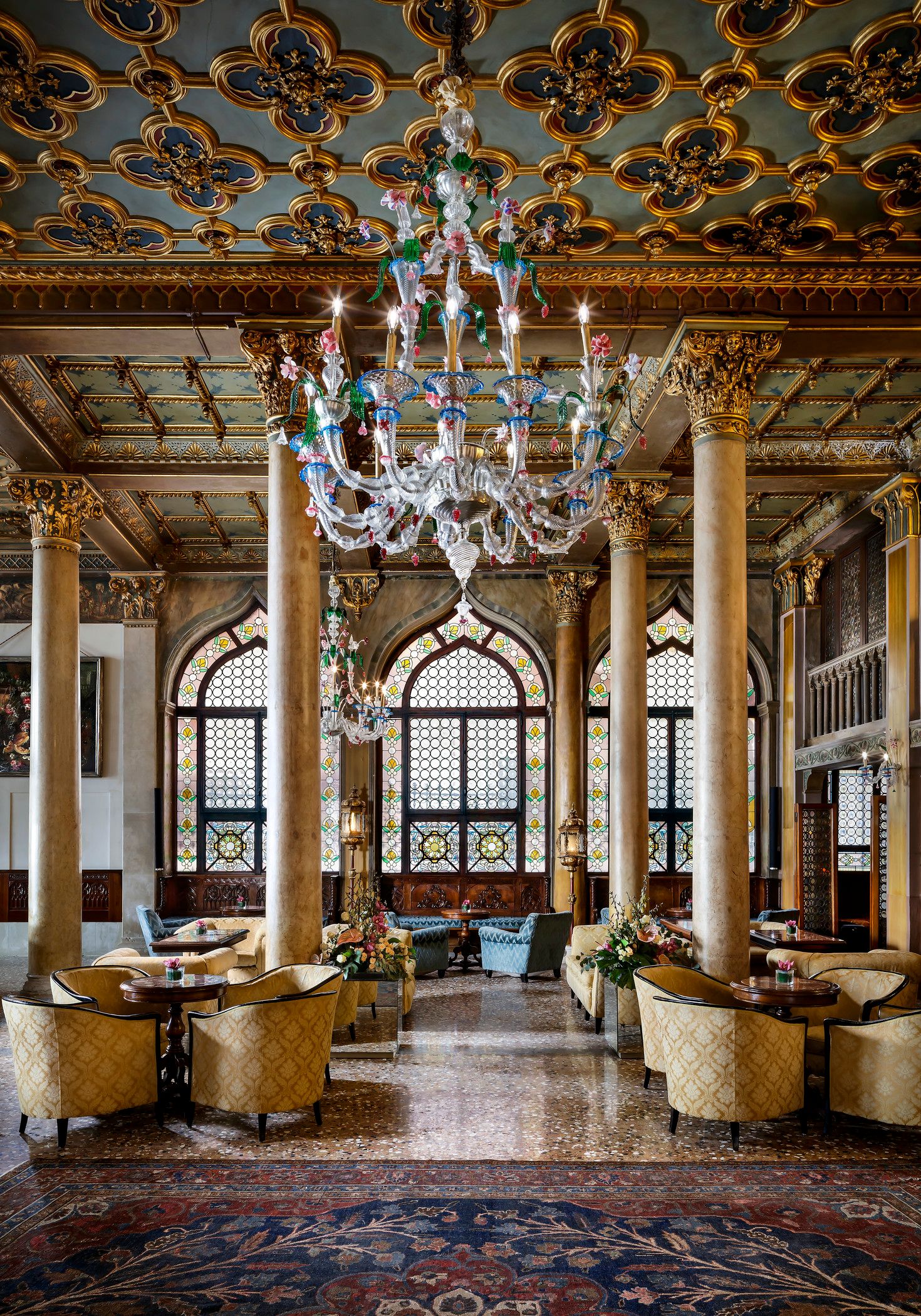 Image may contain Flooring Floor Lamp Chandelier Indoors Interior Design Corridor Building and Architecture