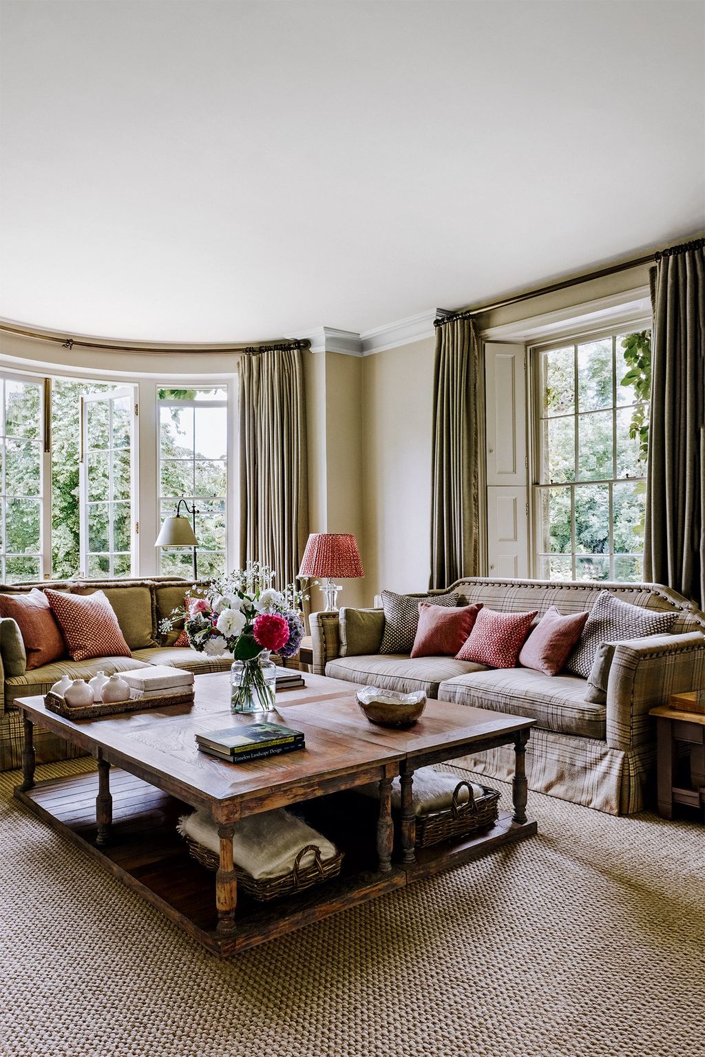 Image may contain Furniture Table Living Room Room Indoors Coffee Table Couch Rug Interior Design and Cushion