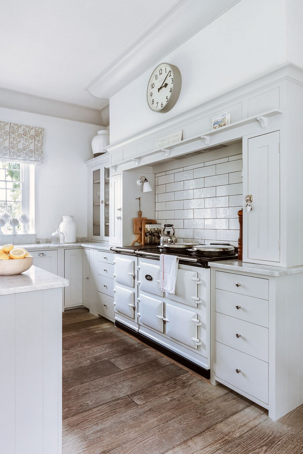 Image may contain Indoors Room Kitchen Building Clock Tower Architecture Tower and Furniture