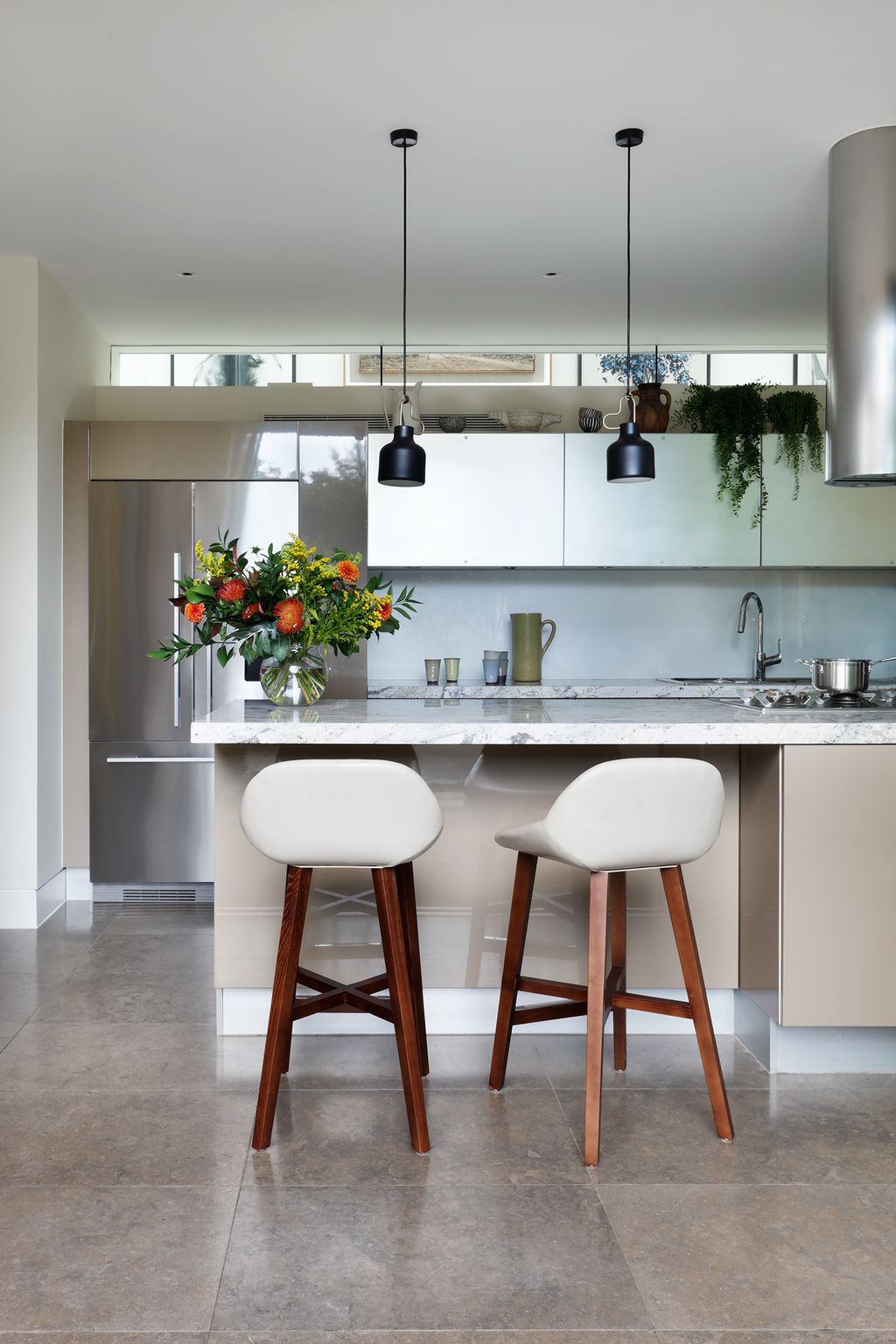 Image may contain Furniture Indoors Room Kitchen Kitchen Island and Bar Stool