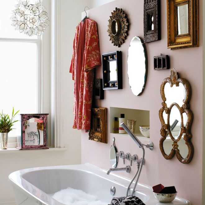 Create a wall of mirrors  don't be afraid to mix different shapes styles and sizes. The more the merrier... For an extra...