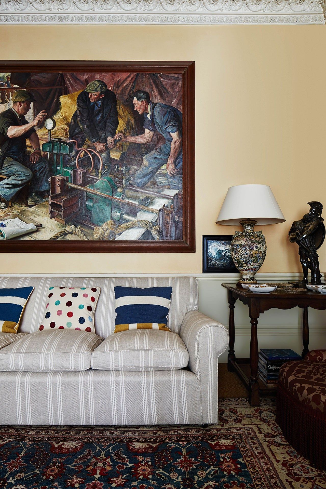 Image may contain Human Person Lamp Table Lamp Living Room Indoors Room Furniture and Rug